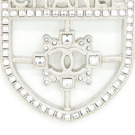 chanel shield brooch